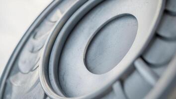 a close up of a metal surface with a circular design photo