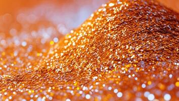 A pile of orange glitter on a table photo