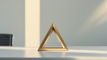 Golden triangle geometric shape on table in modern office photo