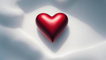 A red heart shaped object on a white surface photo