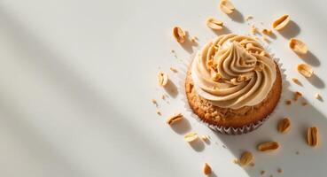 A cupcake with peanut butter frosting on top photo