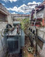 Disused and broken transformer in a ruin photo