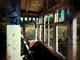 View through a small ruined house with grungy style photo