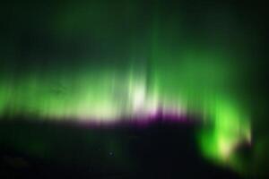 Aurora borealis in green, white and violet photo