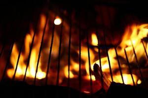 Macro of a barbecue grill on fire photo