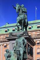 Historic statue of Gustav II Adolf in Stockholm from 1796, the pedestal statues were added in 1906 photo