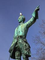 Historic statue of King Charles XII from 1868 in Stockholm, with a herring gull photo