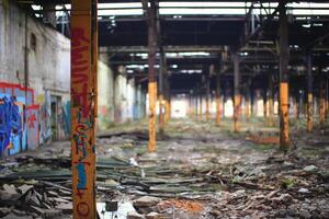 Detail of desolate steel pillar in abandoned factory building photo