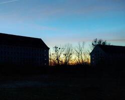 Abandoned storage buildings in east Germany in dusk photo