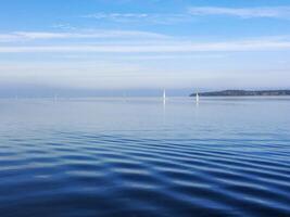 Several sailing ships in the distance at the German coast photo
