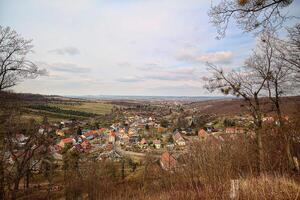 Rural landscape in Saxony-Anhalt, Germany, with the town Stecklenberg, fields and meadows photo
