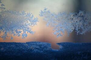 Close up of window frost and snow on a pane photo