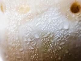 Ice water vapor outside the glass. Bubble pattern abstract background art design. Blurred background. photo