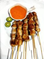 Sate taichan or taichan satay, Made from chicken meat. Served with Sauce and lime. photo