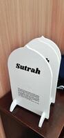 White board sutrah used for the barrier of people praying on the carpet of the mosque photo
