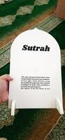 White board sutrah used for the barrier of people praying on the carpet of the mosque photo