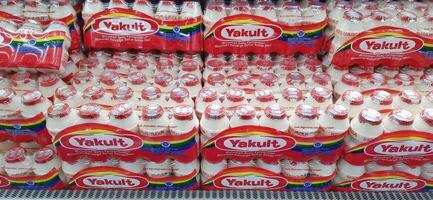 Fresh drink Yakult on display for sale at the naga swalayan supermarket. Jakarta, Indonesia - December 24 2024 photo