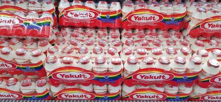 Fresh drink Yakult on display for sale at the naga swalayan supermarket. Jakarta, Indonesia - December 24 2024 photo