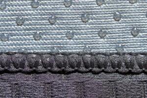 Close up of textured grey fabric with intricate patterns and raised dots. photo