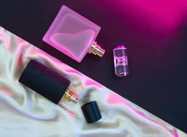 Flat lay composition with two perfume bottles photo