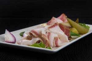 Homemade chunks of salted bacon photo