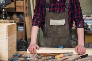 Carpenter working with a chisel photo