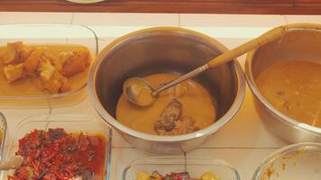 Two Bowls of Soup in a Communal Dining Setting video
