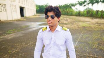 Pilot walking in slow motion on paved area video
