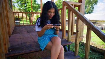 Gamer Girl lost in her mobile game video