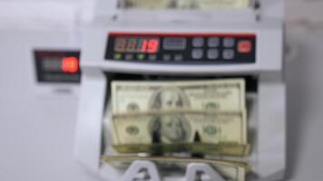 Money counting equipment for paper money calculation. Automatic mechanism for bank financial operations. Currency exchange of one hundred usd. video