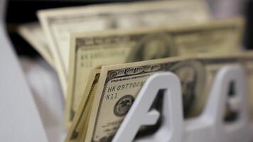Counting dollar banknotes. Money counting equipment for paper money calculation video