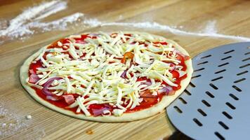 Half ready pizza with cheese, mushrooms, bakon and tomato souce. Pizza ready to be baked in an oven. Food concept. video
