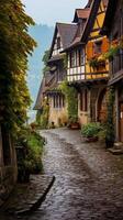 Charming cobblestone street in a quaint european village photo