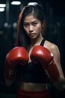 Determined young female boxer with intense expression photo