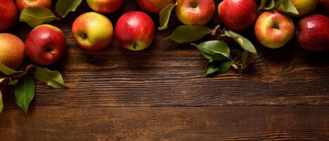 assortment of fresh red and yellow apples on a rustic wooden table photo