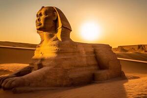 ancient egyptian sphinx statue at sunset in the desert photo