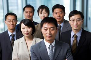 Diverse group of asian business professionals in formal attire photo
