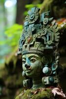 Weathered stone statue with intricate carvings in a lush, green environment photo