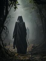 Mysterious hooded figure in dark forest photo