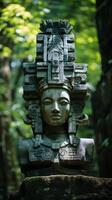 ancient mayan or aztec stone carving in lush green jungle photo