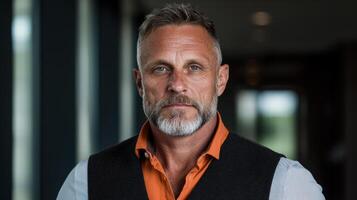 Portrait of a confident middle aged man in a waistcoat photo