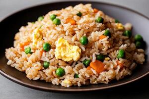 Delicious egg fried rice with peas and carrots photo