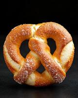 Close up of a freshly baked pretzel sprinkled with salt photo