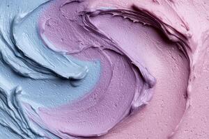 A close up of a blue and pink frosting photo