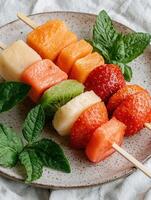 Refreshing fruit skewers with watermelon, strawberries, kiwi, and pineapple photo