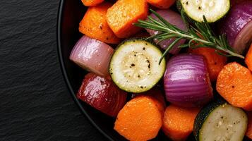 Roasted root vegetables and zucchini with rosemary photo