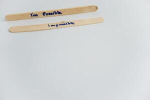 handwriting messages on ice cream sticks in close-up as a concept for building self-esteem photo