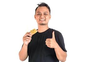 Enjoying a Delicious Snack with a Thumbs-Up Approval photo