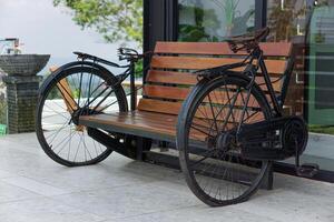 A unique bench design featuring vintage bicycle wheels for a rustic charm. photo