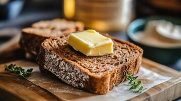 A Slice of Hearty Brown Bread with Butter photo